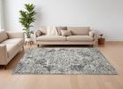 8' X 11' Ivory Machine Woven Distressed Diamond Floral Medallion Indoor Area Rug